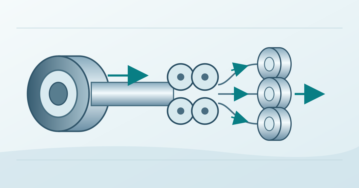 Wide steel coil divided into narrow coils by a bank of circular knives.