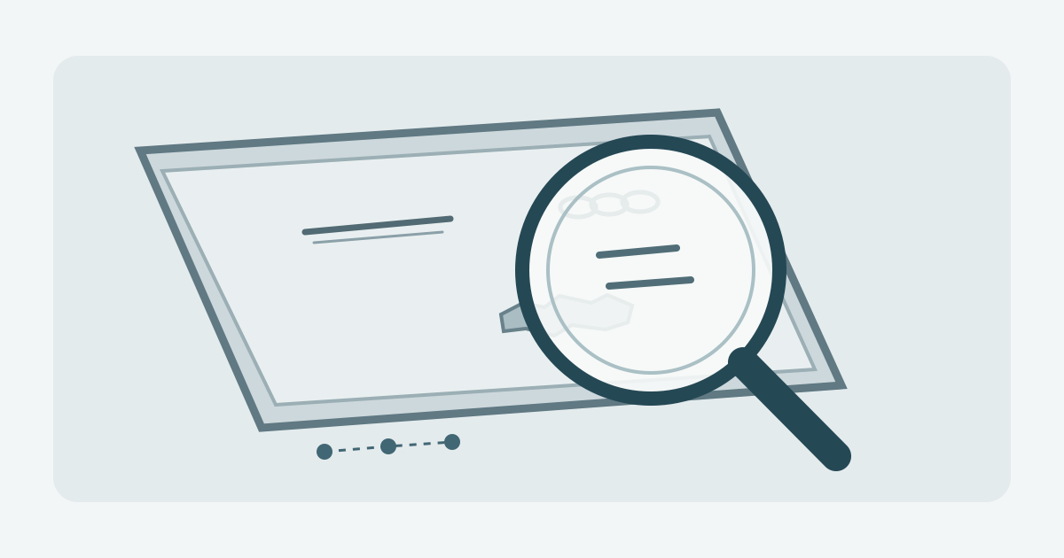 A steel sheet with several distinct surface features examined through a magnifier beside a location record.